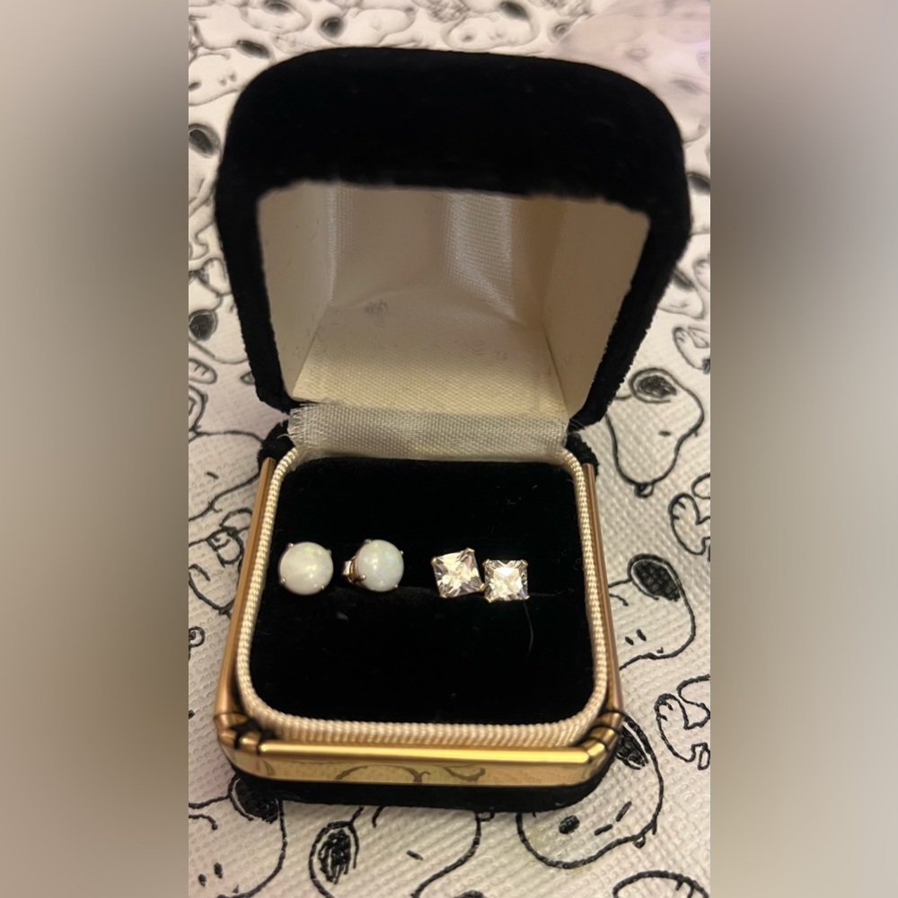 Set of two pairs of 10K gold stud earrings, sold together.